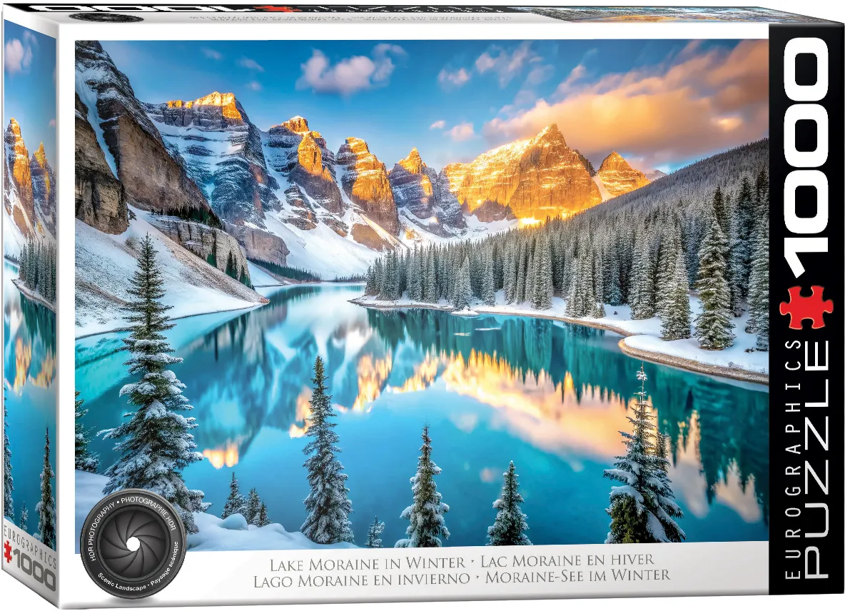 The scene shows glowing alpine peaks above snow-dusted evergreens and a still turquoise lake reflecting the sunrise. Icy blues, golden light, rock faces, and forest textures shape the winter panorama.