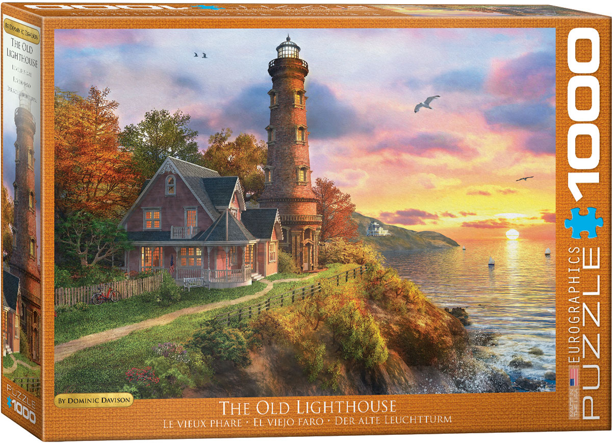 A sunset is viewed from the top of an old lighthouse.
