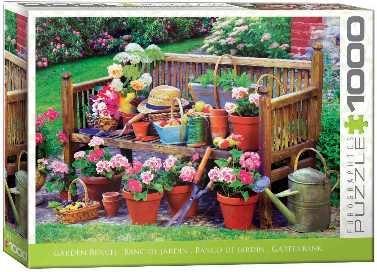 A garden bench anchors a yard filled with abundant spring flowers as the garden comes to life.