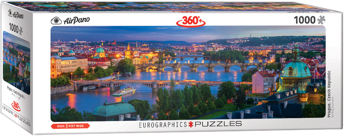 A broad view of Prague unfolds around the Vltava River, which winds through the city among varied architectural styles.